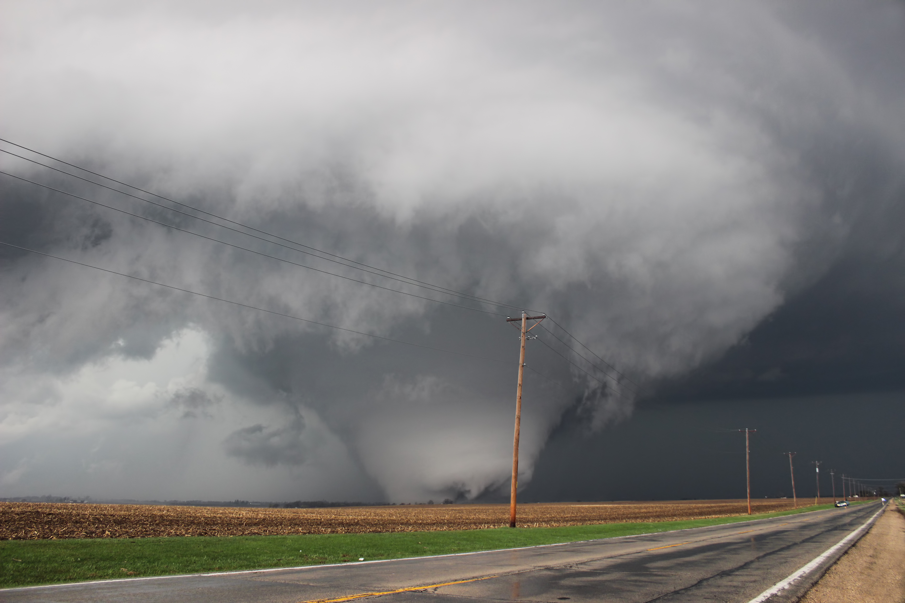Massive and powerful wedge shaped tornado photographed from approximately one mile away