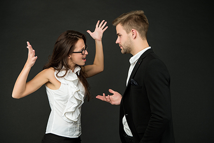 Disagreement among colleagues. Emotional woman and man fight dark background. Professional or personal conflict. Conflict resolution and professionalism in workplace. Poor business communication.