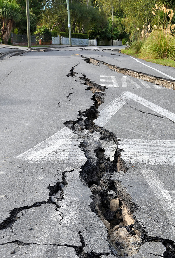 crack in a road caused by an earthquake