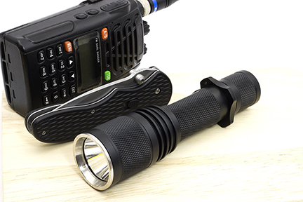 A Flashlight, Knife, and Transceiver