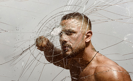 Man punching glass