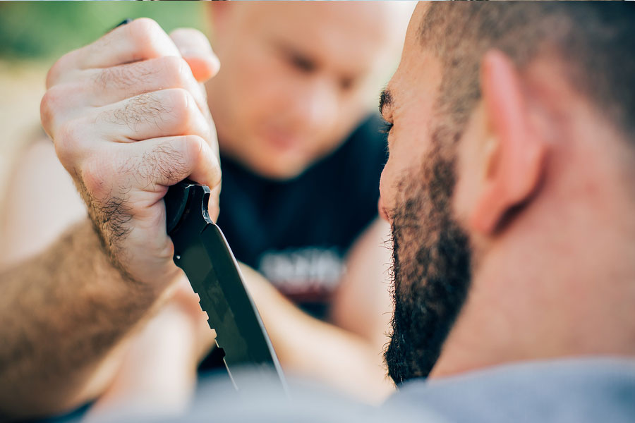 Man stabbing a man with a knife