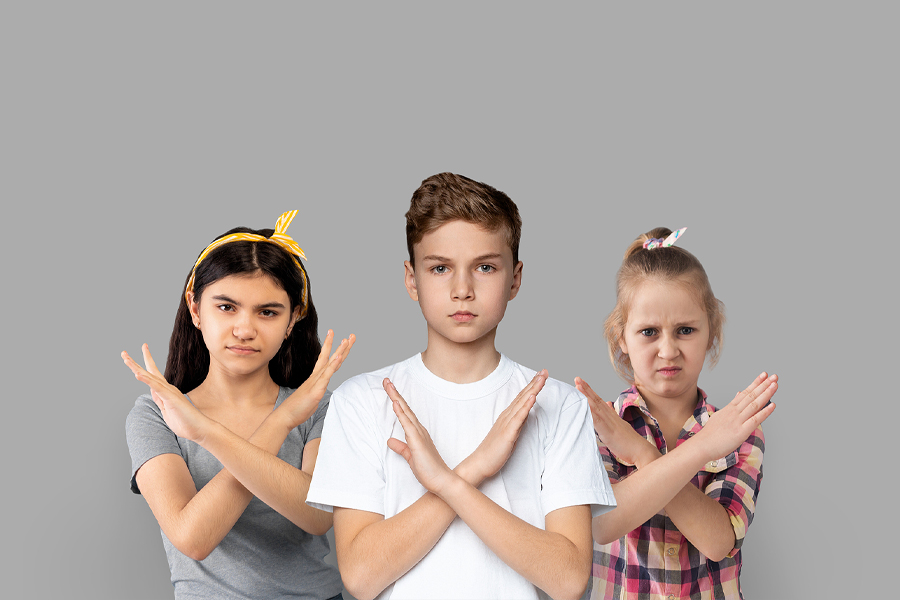Group Of Kids Showing Stop Gesture With Crossed Hands