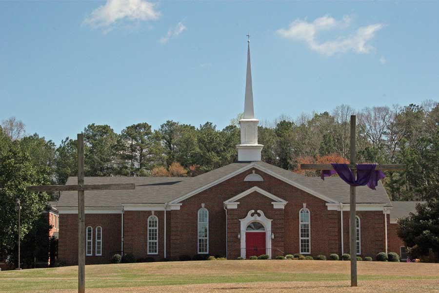 picture of church with two crosses in front