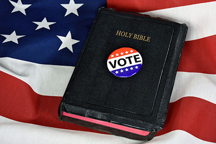 Voting Button and Holy Bible on American Flag